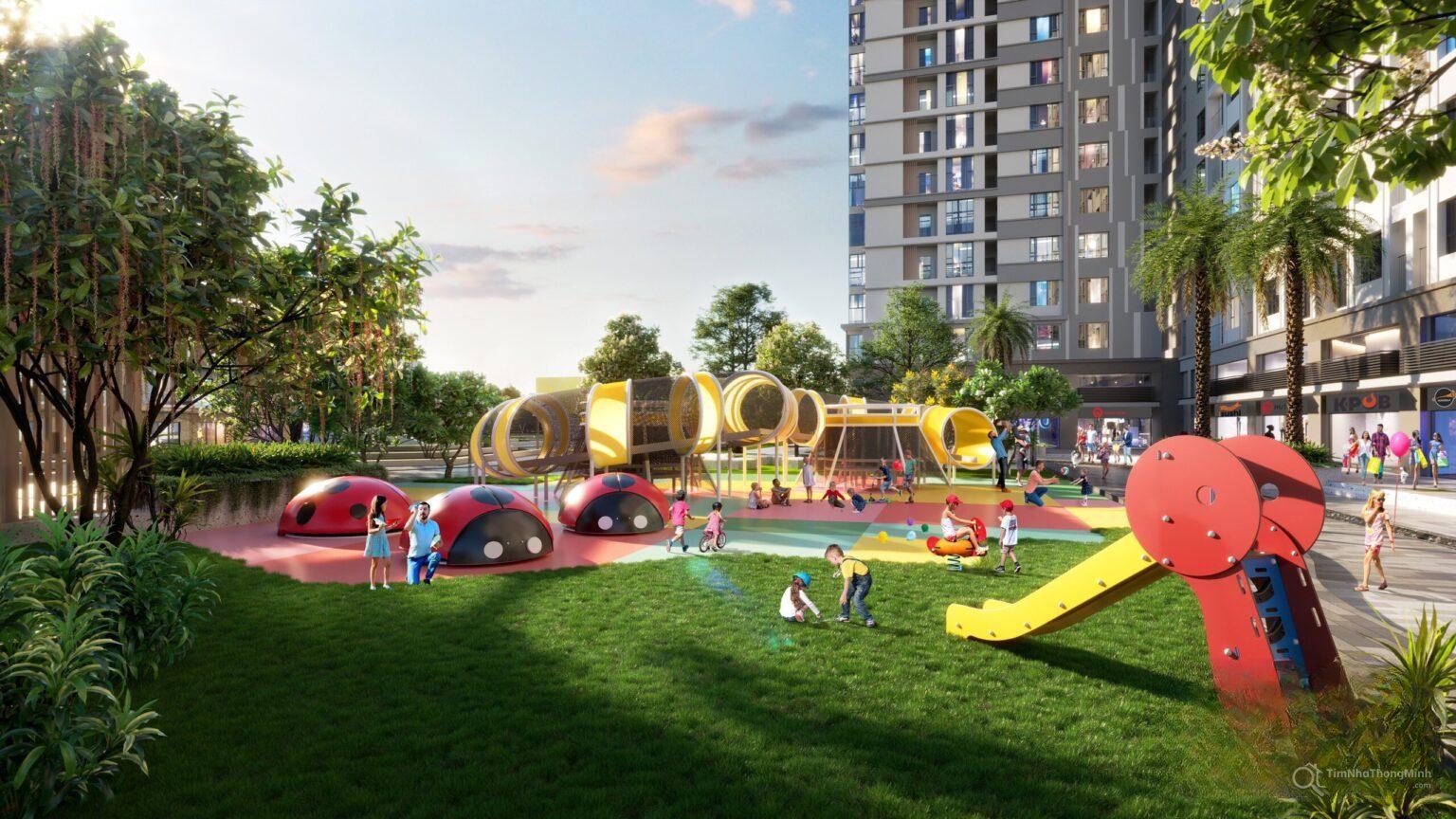 A playground with slide and buildings in the background Description automatically generated