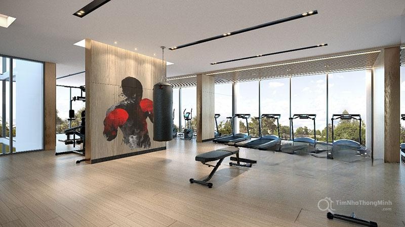 A room with exercise equipment and a large window Description automatically generated